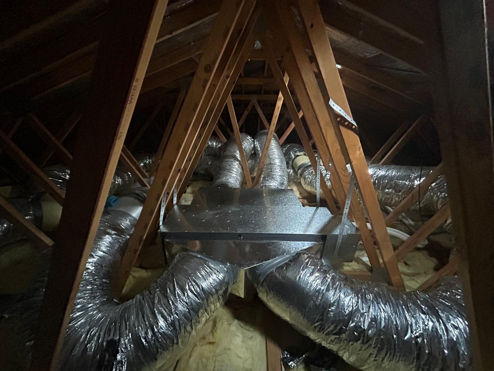 Ducted air conditioning system with insulated flexible ducting in roof cavity